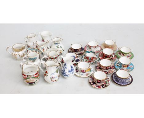 ROYAL WORCESTER; twelve miniature cups and saucers to include 'Royal Lily', 'Strings of Flowers' and 'Wheat Sheaf', also a co