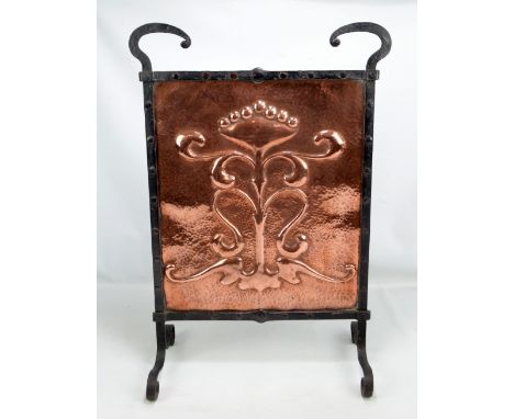 An Arts and Crafts beaten copper fire screen with wrought iron frame, height 74cm.