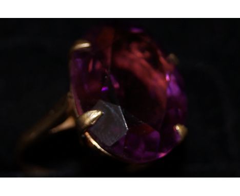 9ct gold dress ring set with very large light purple stone. Size O. 6.2 grams