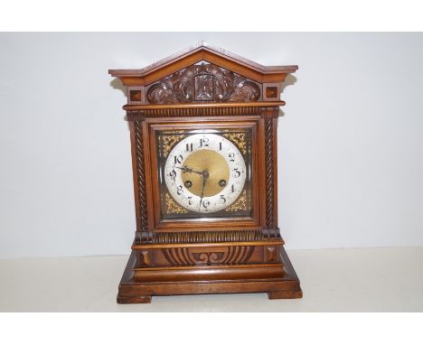 Junghans oak mantle bracket clock with ornate gilt decoration. Currently ticking. 43cm high