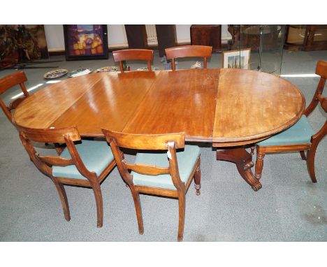 A 19th century mahogany dining table of most unusual and rare design, having a split centre pedestal, encompassing a ridgid t