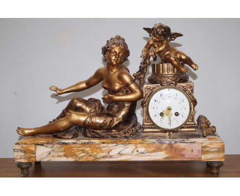 French gilt and marble ornate mantle clock with semi clad lady and cherubs 53cm wide