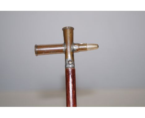 Unusual swagger stick with two cross bullets 