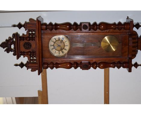 Vienna wall clock with carved lion features and finial. 125cm