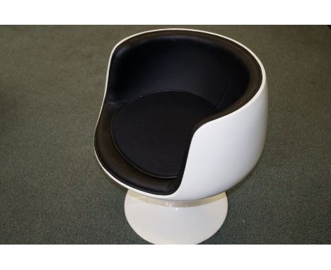 Mid/late century Cognac chair in the style of Eero Arnio, Finland (No markings) Black leather upholstery with removable fitte