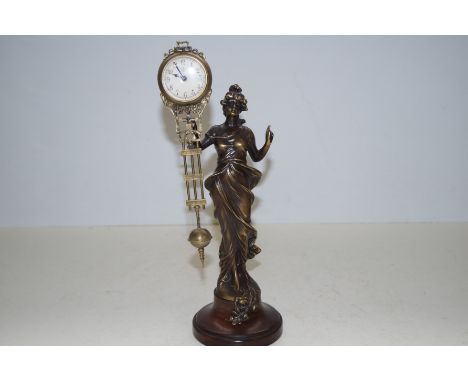 Junghans bronze lady figure with a swinging clock 35cm high