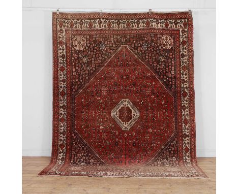 A Senneh carpet, 20th century, Persian, with central diamond medallion, to a red ground to oatmeal borders,294 x 204cmConditi