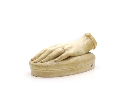 A plaster sculpture of a hand dated 1847, signed 'Cecile de Clermont' to the underside,21cm wideCondition ReportAn old repair