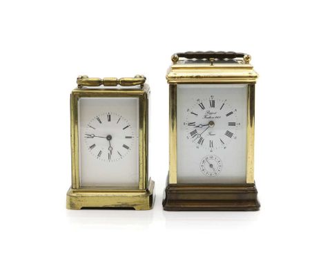 A brass repeating gorge case carriage clock 20th century, French, with eight day movement striking on a gong, the white ename