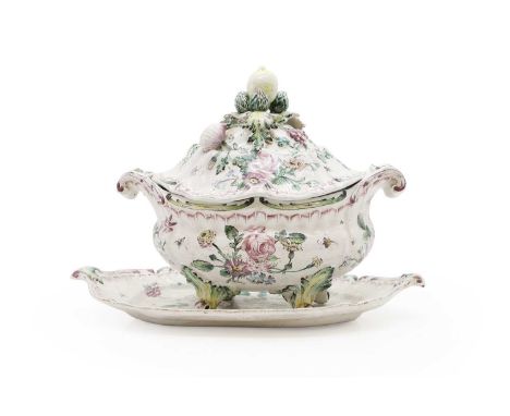 A French faience tureen and cover 18th century, possibly by Veuve Perrin, indistinctly signed to base and stand, ornately dec