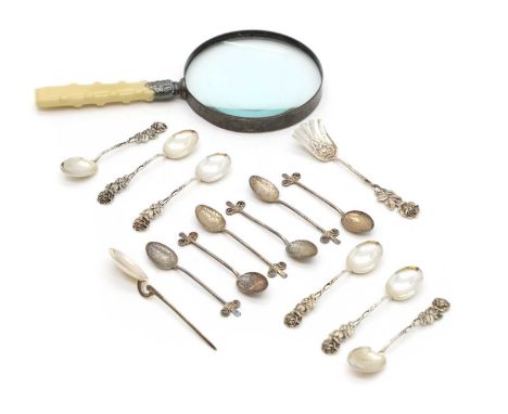 Three cased sets of silver spoons, comprising a set of six Albany pattern tea spoons with tongs, Sheffield 1911, another set 