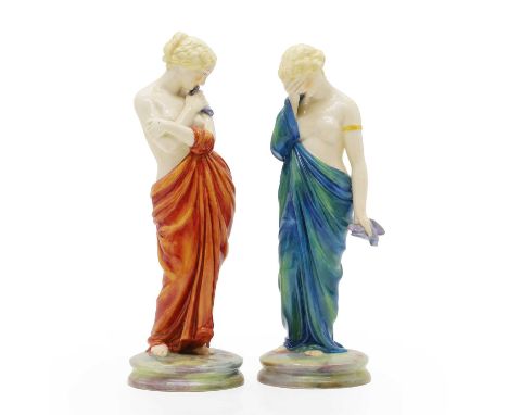 A pair of Royal Worcester porcelain figures 1907, Joy and Sorrow, modelled by James Hadley, 2/57 &amp; 2/47, painted and prin