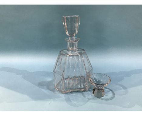 A clear glass decanter, with a set of twelve liqueur glasses