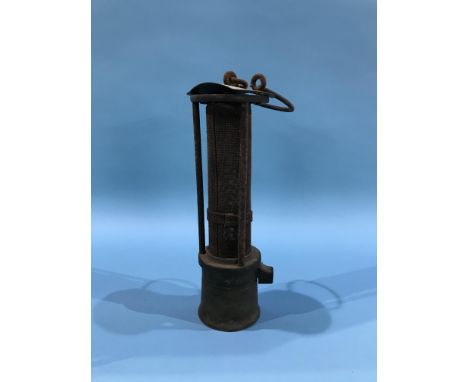 A wire mesh three bar miners lamp