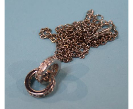 A white metal pendant and chain