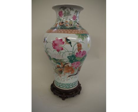 A Chinese large famille rose inverted baluster vase,&nbsp;Qianlong seal mark,&nbsp;painted with geese and other birds in a fl