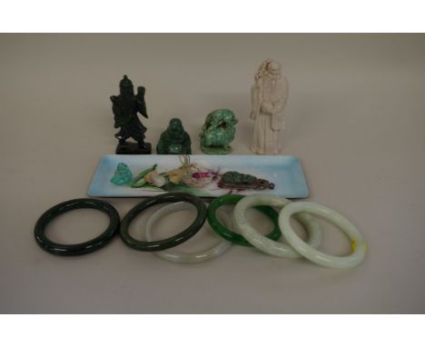 A mixed group of oriental items,&nbsp;to include Chinese jade bangles; a Chinese white metal mounted pendant, 6cm long; and a
