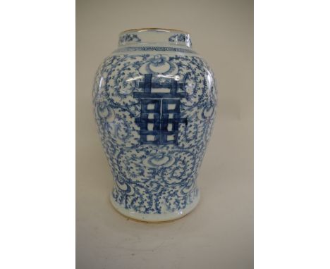 A Chinese blue and white baluster jar, Qing, four character mark to base, painted with scrolls, 37cm high. 