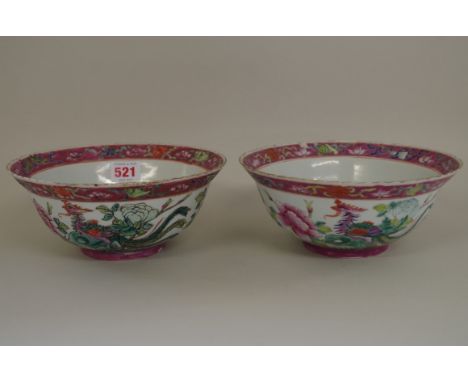 A matched pair of Chinese famille rose phoenix bowls,Â&nbsp;Qianlong seal marks,Â&nbsp;20cm diameter, (2). 