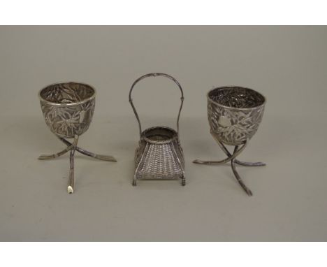 A pair of Chinese silver egg cups, by Wang Hing,&nbsp;decorated with bamboo, 7cm high, 97g;&nbsp;together with&nbsp;another o