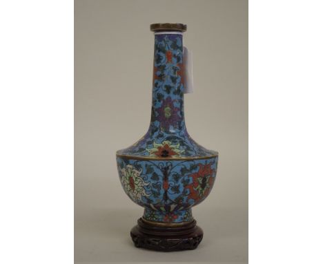 A Chinese cloisonne enamel bottle vase,Â&nbsp;probably 17th century,Â&nbsp;decorated with lotus leaves, 18.5cm high, on pierc