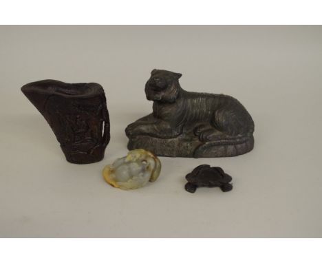 A Chinese celadon and russet jade carving,&nbsp;5.7cm long, on wood stand;&nbsp;together with&nbsp;a horn libation cup, 8.5cm