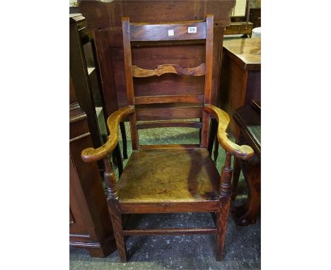 A late 18th early 19th century elm and fruit-wood ladder backed arm chair