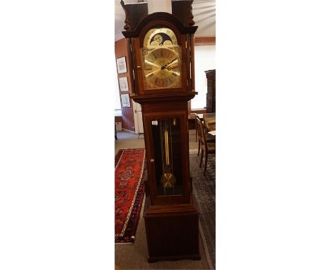 Reproduction mahogany cased Grandfather Clock with 8 day movement. Moon phase playing tunes on the quarter hour. Glass door t