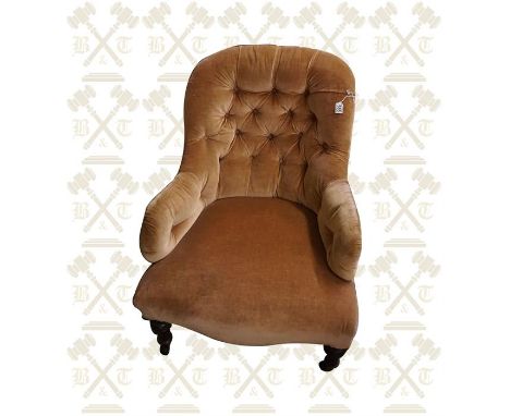 A ladies Victorian button backed chair with turned walnut stained legs. 