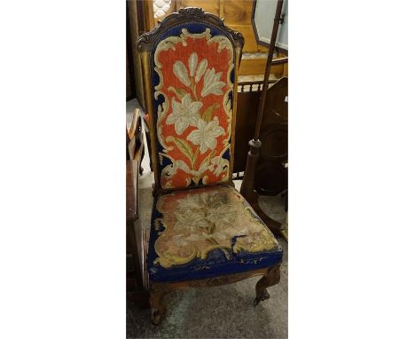 A Victorian walnut prayer chair with carved in wool work tapestry