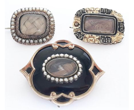 A group of three 19th century yellow metal mourning brooches comprising two with plaited hair centre and half cut pearl borde