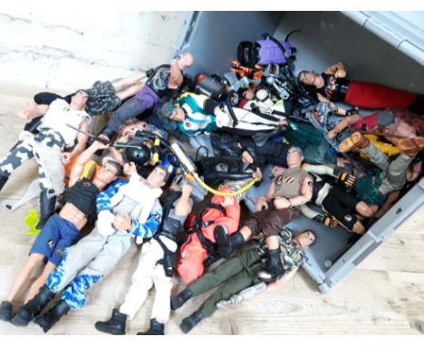 A box of Action Man figures.