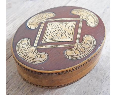 A 17th Century horn and wood snuff box of oval form with verse to top 'It Is A Frend To Whom I Lend' and pique inlaid borders