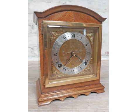An Elliot domed top mantle clock with brass and steel dial, height 20cm.  