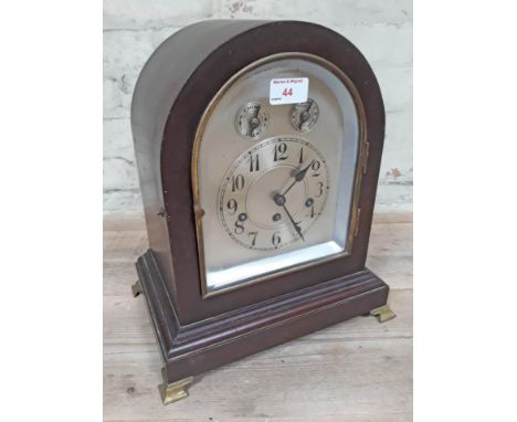 A steel dial mahogany cased mantel clock, height 35.5cm, width 31cm, depth 22cm.  Condition - pendulum present but has no win