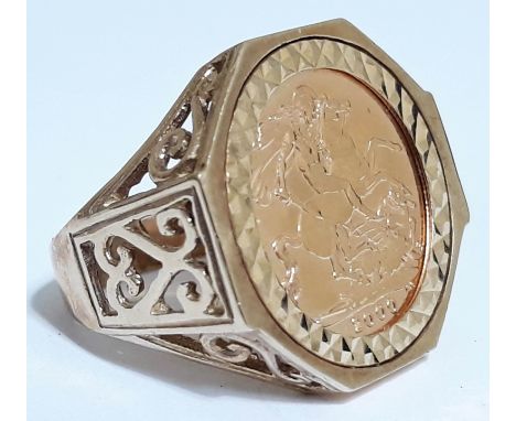 A hallmarked 9ct gold ring set with an Elizabeth II 2000 half sovereign, gross weight10.1g, size R.  