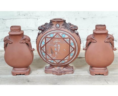 A Watcombe pottery moonflask and pair of vases in the manner of Christopher Dresser.Condition:  Various chips to bases and to