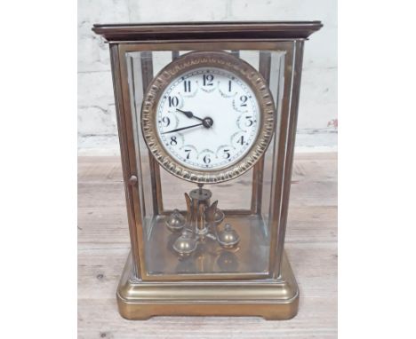 A German four glass torsion clock with enamel dial, diameter 9cm, height 27cm.  
