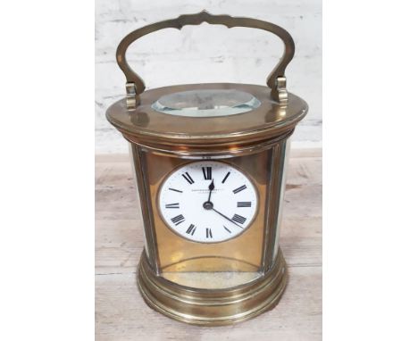 A late 19th Century four glass brass carriage clock of oval form, French movement inscribed 'R&Co', the dial with Roman numer