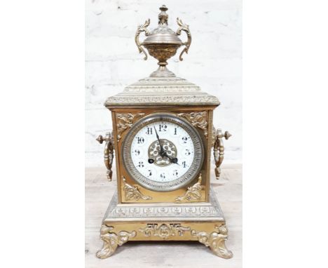 A French late 19th Century gilt brass mantle clock with enamel dial, height 39cm.  