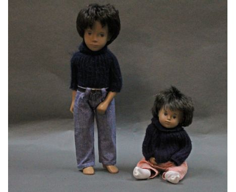 Two hard vinyl Sasha dolls, both having dark brown rooted hair, and comprising a Gregor doll and baby doll, the tallest measu