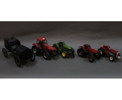 A group of scale model tractors by Britain's and Siku, plus other models, including a Britain's Ertl scale model of a John De