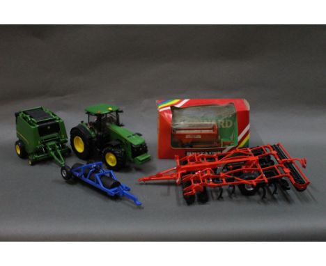 A box of Britain's John Deere tractor and implements, to include a boxed Howard Rotaspreader