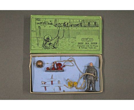 A Crescent toys No.1224 "Deep Sea Diver" set, to comprise diver, air pump and salvage tools, displayed with green illustrated