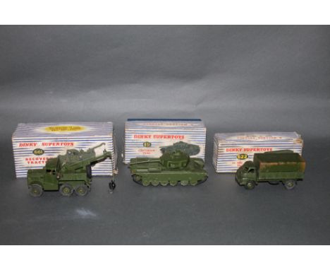 A group of three Dinky military vehicle models, to comprise a recovery tractor (661), in army green, a three-ton army wagon (