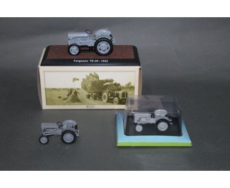 An Atlas Editions scale model of a 1953 Ferguson TE-20 tractor, a scale model of a 1947 Ferguson TE-20 tractor, and a Univers