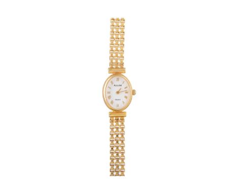 ACCURIST NINE CARAT GOLD QUARTZ WRIST WATCH the oval white dial with Roman hour markers, 15mm case, on a nine carat gold brac
