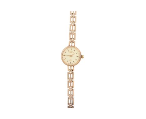 ROTARY NINE CARAT GOLD QUARTZ WRIST WATCH the round cream dial with baton hour markers, 18mm case, on a nine carat gold brace