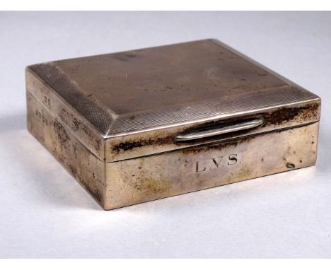 A silver cigarette box - Birmingham 1951, engine turned with chamfered edges, width 10cm