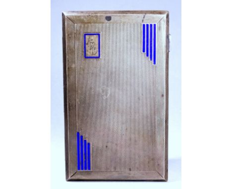 A silver cigarette case - Chester 1932, of rectangular form, engine turned with blue Art Deco enamel, weight 212g.